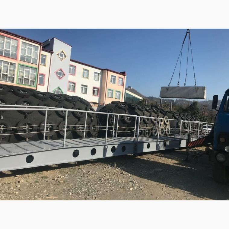 Truck delivering pontoon fenders and a floating platform